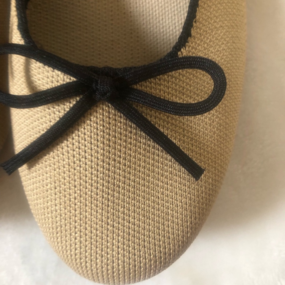 Rothy's Beige Ballet Flats with Black Trim and Bow - Picture 2 of 5